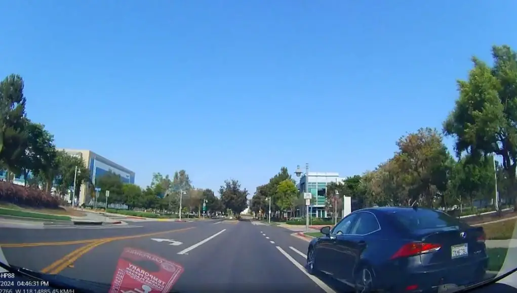 Lexus uses bike lane as passing lane in Long Beach, CA near Douglas Park.