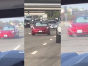 Tesla Model 3 driver caught on camera driving with his front windshield obstructed by a sunshade.