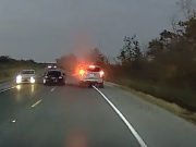 A vehicle in Pierra Part, Louisiana is seen on LA-70 dangeroulsy overtaking, splitting between two vehicles.