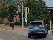 A scooter rider entering an intersection in Normal, IL a moment before he gets hit by a turning car.