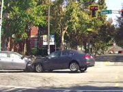 Two drivers in Atlanta GA near Georgia Tech try to beat a red, end up crashing into each other.