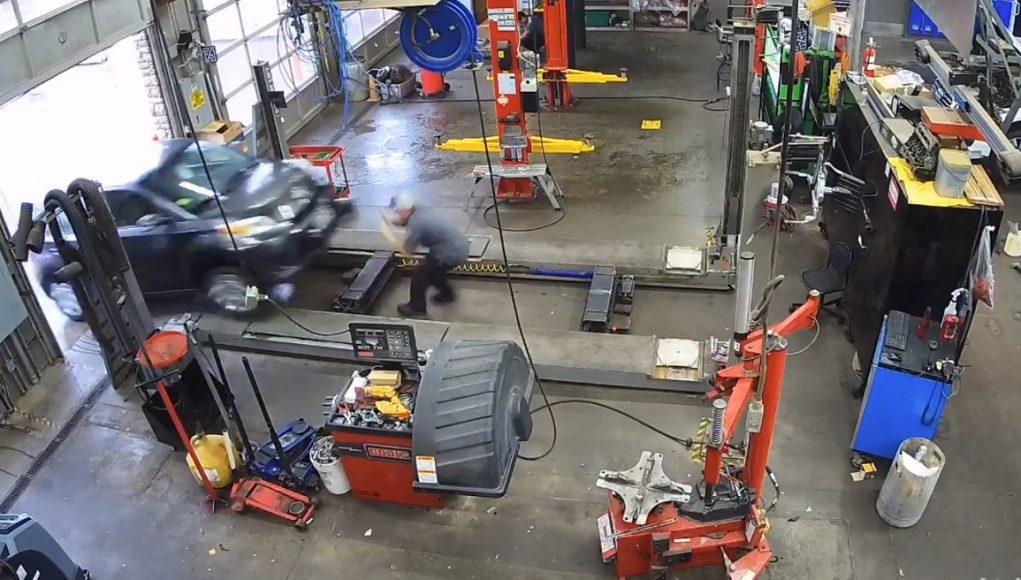 Car mechanic survives customer's car driven by employee running over him.