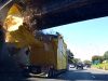 An oversized load hauler hits the top of his trailer on this I-40 CSX Overpass in Nashville