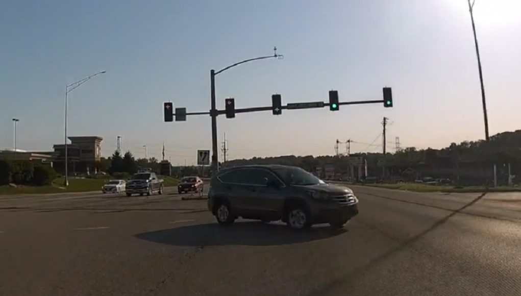 A redlight runner on Manchester Road in Manchester, MO almost gets t-boned.