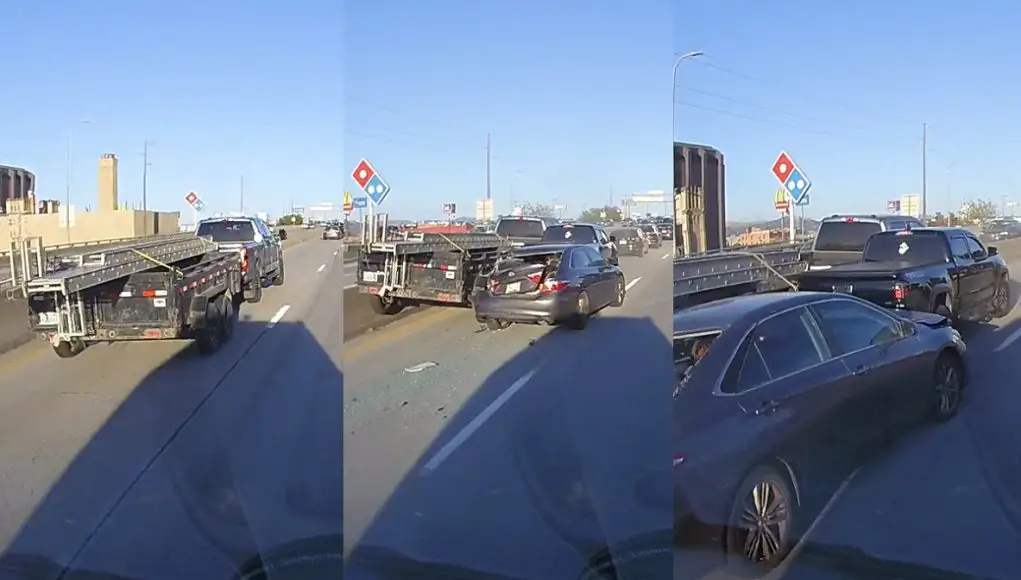 A distracted driver in a truck towing a utility trailer on I-90 in Spokane fails to slow in time, wedges himself between two vehicles and a freeway barrier.