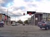 A Subaru Forester on two wheels, shortly after getting clipped by a driver in a red light-running Ford Escape.