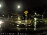 Driver in Kirkland roundabout stops in the middle of it and reverses, almost causing an accident.