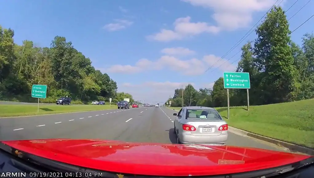 A driver in Gainesville, GA recklessly merges onto US-15 encroaching upon other driver.