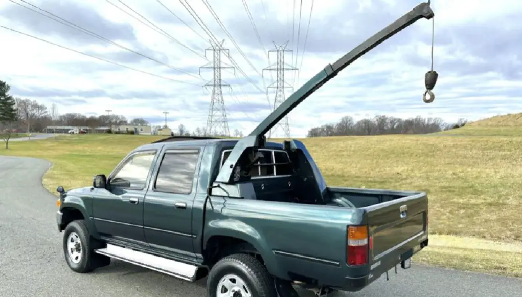 A 1995 Toyota Hilux with factory mounted crane.