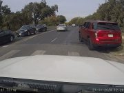 Unhinged driver hoping onto W Cesar Chavez St. sidewalk in Austin.