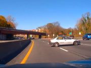 Driver on Bronx River Parkway makes u-turn and drives against traffic to avoid missing their exit.