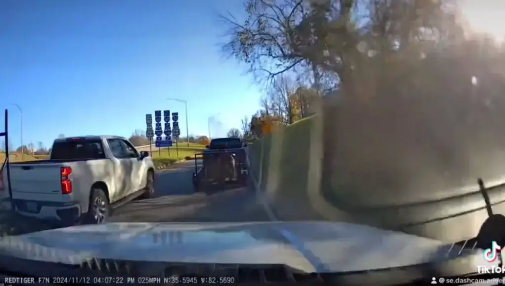 A reckless pickup driver on US-23 crosses over a gore point to cut interchange traffic.