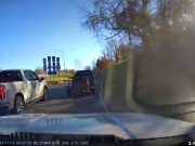 A reckless pickup driver on US-23 crosses over a gore point to cut interchange traffic.