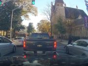 BMW trying to cut traffic in downtown ATL hits pedestrian crossing against a red light.