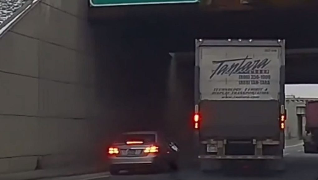 Impatient Mercedes driver's risky interchange lane change gamble ends in being sideswiped by semi.