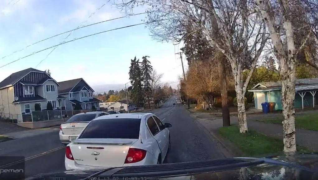 Reckless lane change on East Portland Ave almost forces dashcam owner off the road.