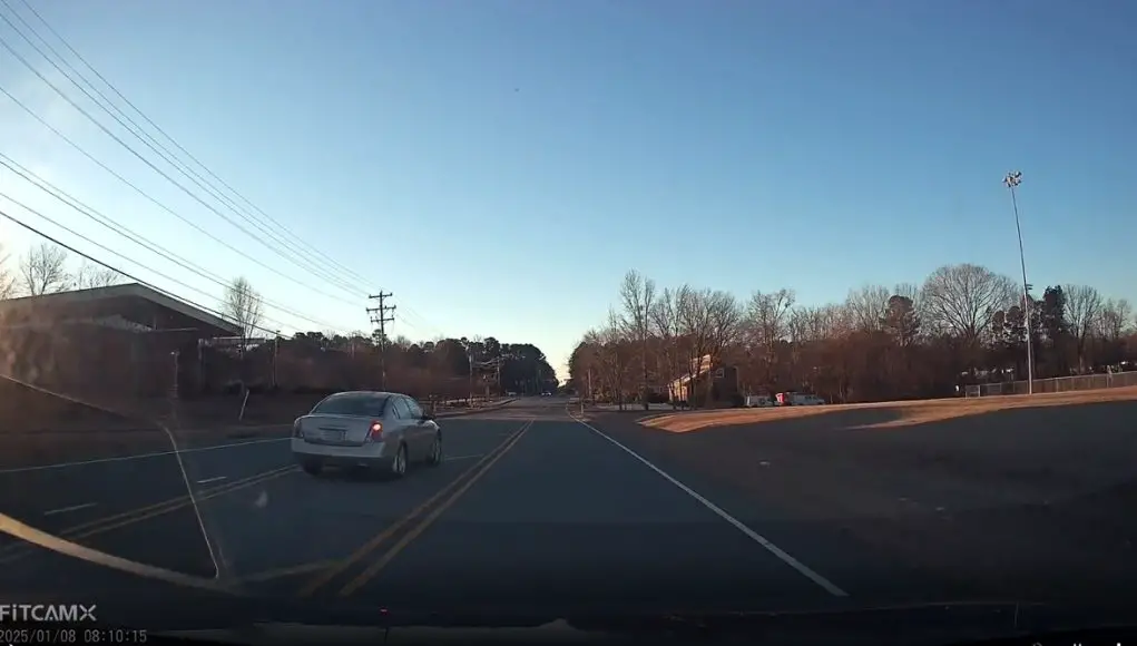 Altima speeds in school zone, overtakes over two sets of double solid yellow lines in Durham, N.C.