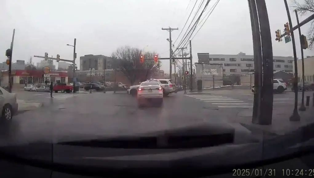 Near red light runner almost t-bones police cruiser at Market and N 412nd St.