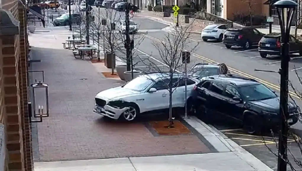 BMW driver on Second St in HIghland Park has brain fart, slams into Jag SUV in front of them, taking out a bench in the process.