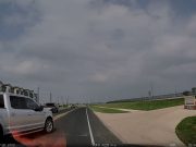 Idiot driver in Del Valle,TX not paying attention doesn't notice turn lane ends. Almost crashes into dashcam owner.