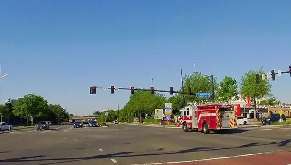 Driver with a green fails to see responding fire truck at Centreville and Worldgate. T-bones them.