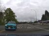 Idiot driver makes illegal left turn on E Main Ave across doube yellow lines and against traffic.