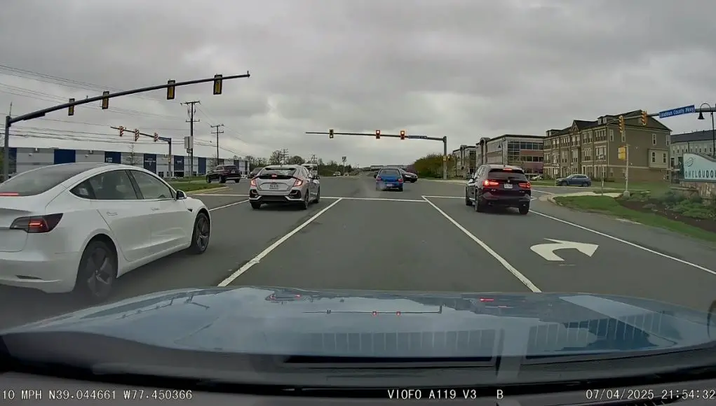 Idiot driver not paying attention on Loudoun County Parkway accidently runs red after left arrow turns green.