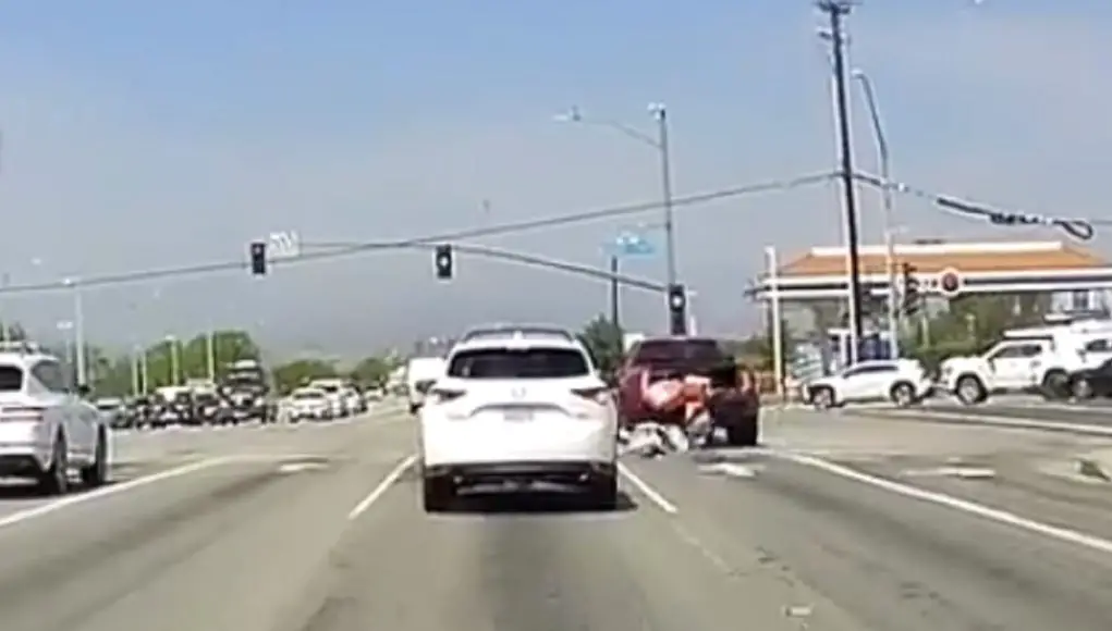 Idiot in dually on Soledad Canyon Rd guns it on yellow only to have all his stuff topple out his truck.