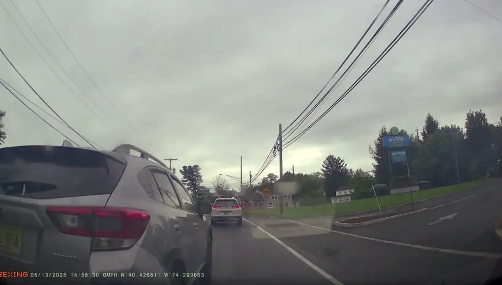 Subaru Crosstrek driver in Matawan on NJ-34 turns careless rolling back into dashcam owner after failing to stop on a slight incline.