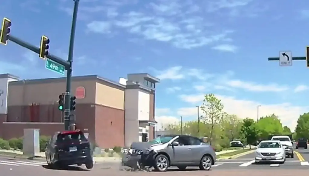Idiot runs red light nearly 10 seconds after light turned at Tower and 49th. T-boned by driver with right of way.