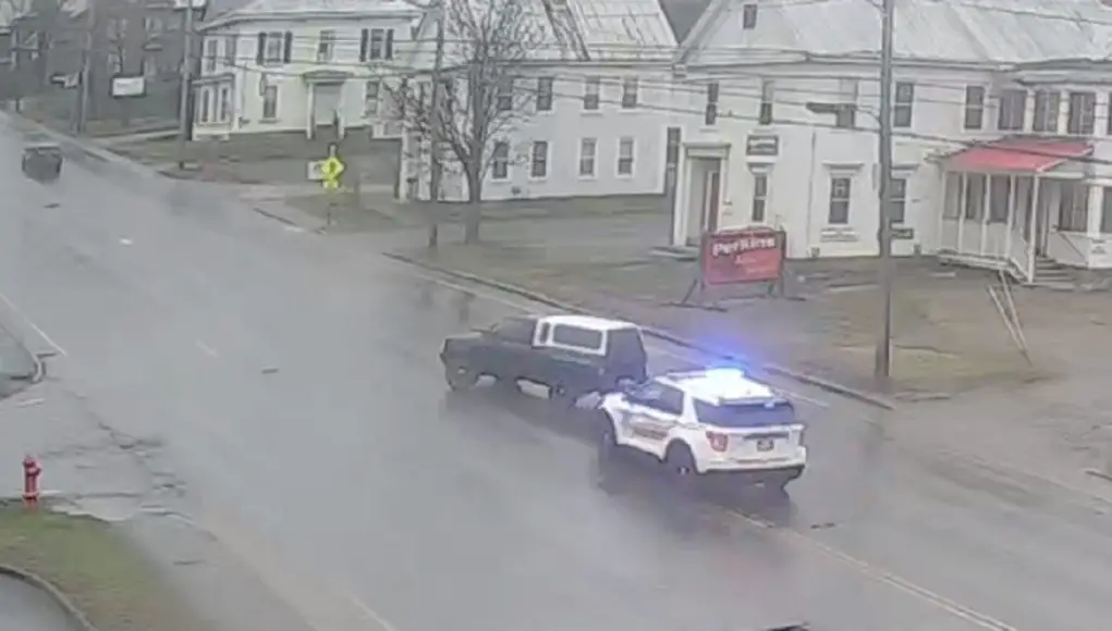 Idiot in Skowhegan makes bonehead left turn from right lane in front of cop.