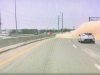 Distracted driver on US-87 realizes they're headed for a gore point at an exit ramp. Slams into sand barrels, hard.