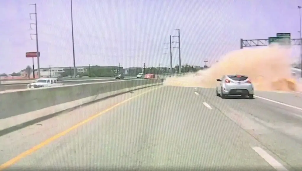 Distracted driver on US-87 realizes they're headed for a gore point at an exit ramp. Slams into sand barrels, hard.