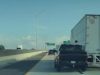Idiot driver, on their phone or drunk on I-35, slams into side of semi truck's trailer causing thousands in damage.
