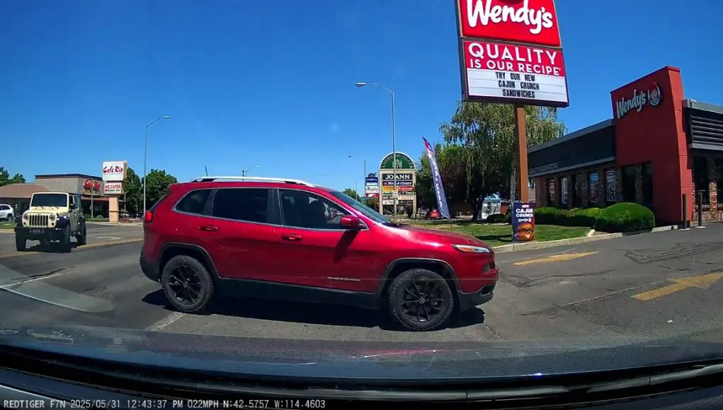 Idiot given the wave of death to drive across multiple lanes by other idiots in Twin Falls almost causes their own t-bone collision