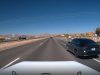Reckless driver on spare tire on I-15 uses emergency shoulder and gore point to overtake on the right.