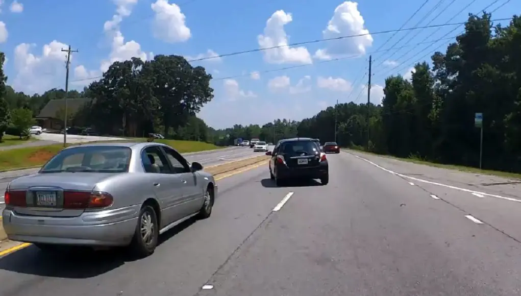 Idiot turning right onto Highway 92 from Anneewakee fails to yield, almost collides with motorcyclist and another driver.