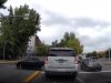 Driver in Seattle on Northgate bothches u-turn, reverses into SUV, right in front of a cop.
