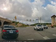 Likely elderly driver caught going the wrong way down La Cantera Parkway before self correcting.