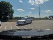 Distracted driver turns into a wrong way turner onto River St.