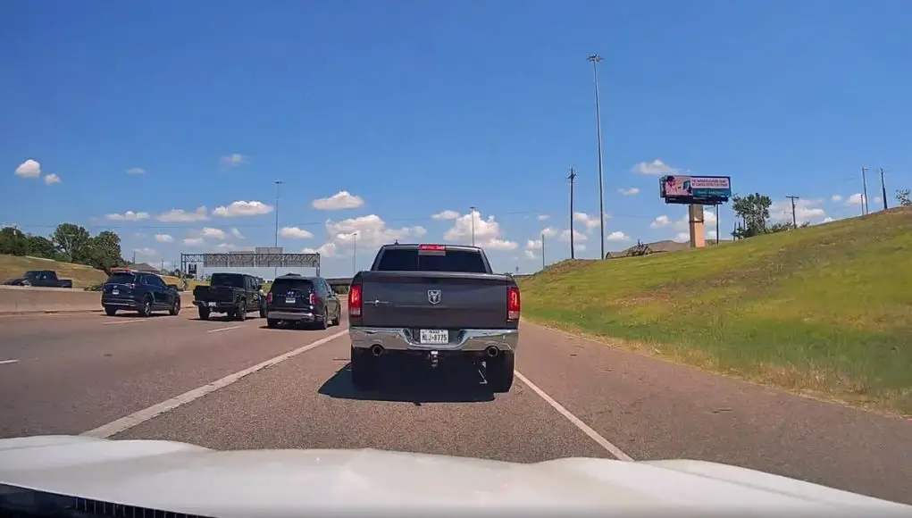 Ram 1500 driver cuts across TX-183 gore point and brake checks dash cam owner for good measure.