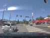 Ignorant driver on E 9th St. and Virginia pleads ignorance, does illegal lane change in the middle of the intersection.