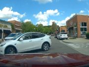 Jerk Tesla drivers bolts out of Harris Teeter parking lot driveway without even trying to yield.