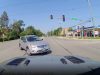 Clueless driver on Ogden Ave makes left turn against red light in front of dashcam owner. Come within inches of colliding.