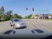 Clueless driver on Ogden Ave makes left turn against red light in front of dashcam owner. Come within inches of colliding.