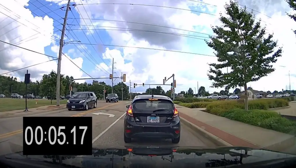 Distracted driver on S Main St. and Highway 40 throws brake check tantrum, runs red light, after being called out.