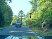 Confused driver blasts through red light in construction zone likely because they don't know what they're doing.