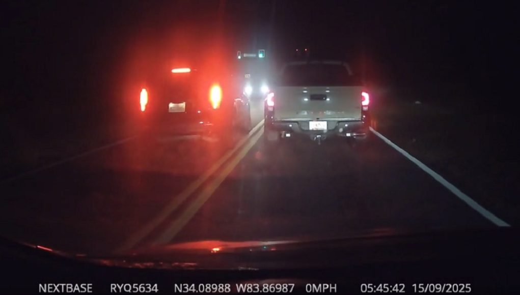 Impatient driver at Flowery Branch and Spout Springs goes against traffic to skip ahead, almost crashes head-on with driver with the right of way.