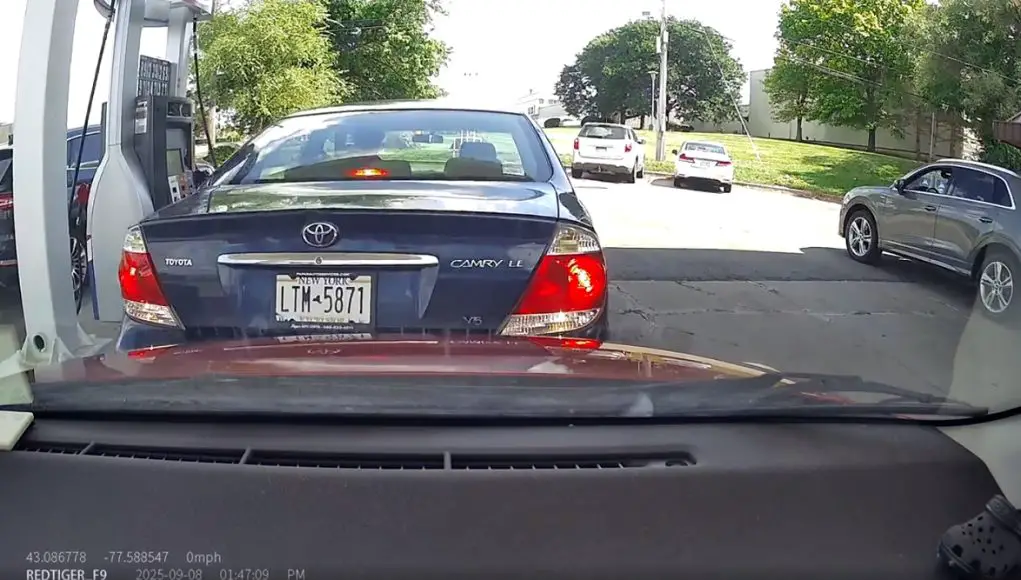 Careless driver reverses into other driver at SNK Fuels gas station, almost looks like insurance fraud.
