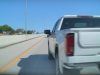 Insane driver gets his ego hurt after a Tesla driver changes lanes in front of him. Strikes back and almost causes his own accident.